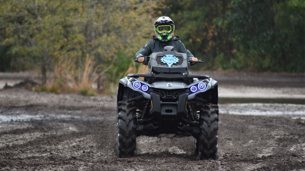 man on atv with more ground clearance