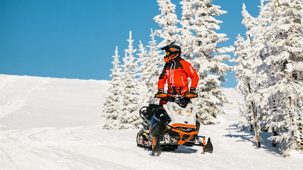 snowmobile riding sun