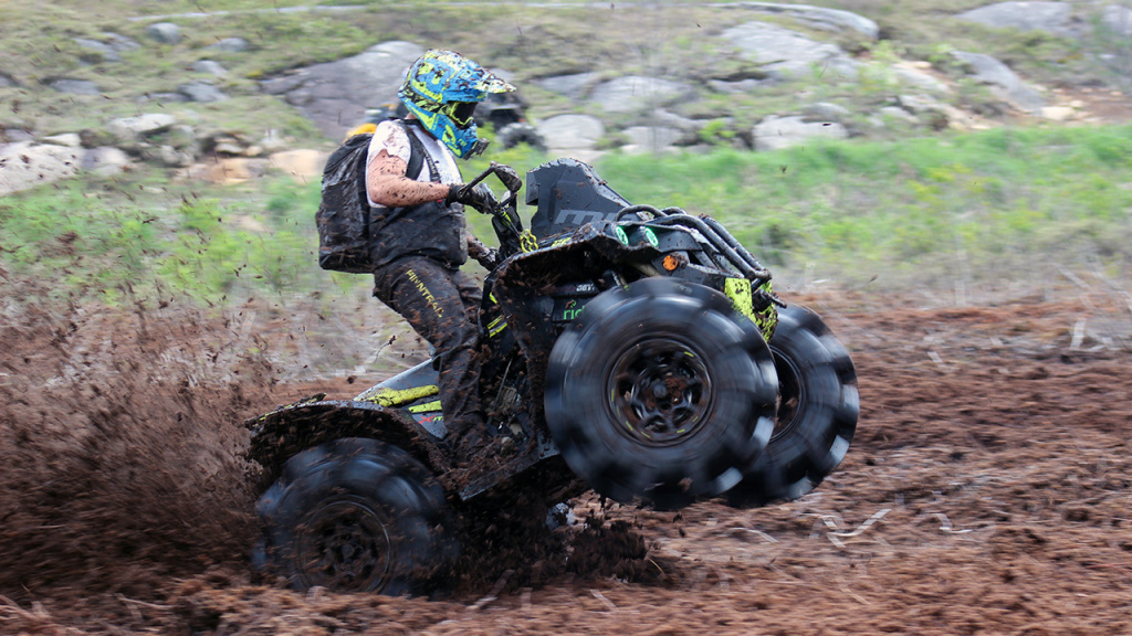 atv riding fast in mud