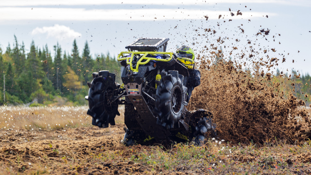 atv wheelie riding in muskeg