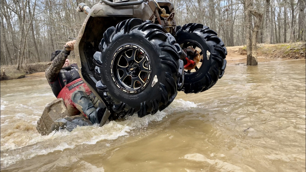 old atv in water