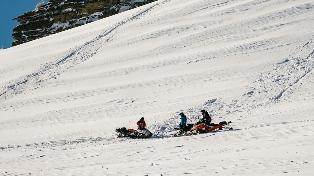 mountain snowmobile riding