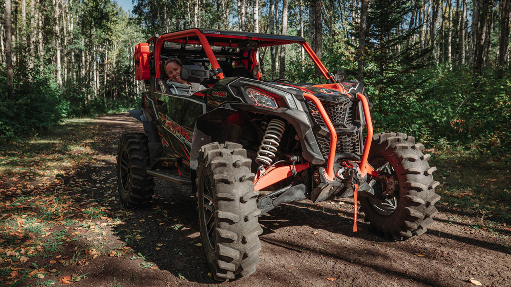 girl in utv with adjust shocks