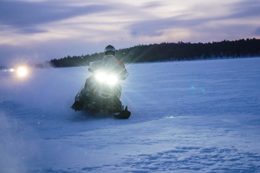 What to Pack for a Snowmobile Trip: The Complete Guide For many riders, planning a winter adventure begins with one essential question: what to pack for a snowmobile trip? Whether you’re heading out for a single day or embarking on a multi-day touring route, preparation can make the difference between a smooth, enjoyable ride and a frustrating, uncomfortable one. Cold weather brings unique challenges, and the right equipment ensures safety, warmth, and confidence on the trail. This guide covers all the important things to take on a snowmobile trip so you can pack like an experienced rider. Essential Riding Gear Your core riding gear is the backbone of your snowmobile trip packing list. Start with a certified snowmobile helmet equipped with a dual-pane or heated visor to reduce fogging. Combine it with insulated, waterproof outerwear specifically designed for snowmobiling; generic ski jackets often lack the durability and wind protection needed for high-speed travel. Beneath your outer layers, rely on moisture-wicking base layers made of synthetic fabric or merino wool. Cotton is best avoided, as it traps moisture and chills quickly. High-quality gloves, or even better, both gloves and mitts, give you options for changing temperatures. Add a neck gaiter or balaclava to protect your face from windburn, and finish with tall, insulated snow boots that offer both warmth and traction. Safety and Emergency Essentials One of the most important aspects of deciding what to pack on a snowmobile trip is prioritizing safety. Even well-maintained sleds can break down in harsh conditions, so it’s wise to be ready for unexpected surprises. A small but well-stocked first-aid kit should always travel with you. A tow strap, spare belt, zip ties, spark plugs, and a multi-tool can get you or someone in your group back on the trail. Because electronics fail quickly in extreme cold, carry not only a GPS device but also a paper map and compass for backup. A fire-starting kit and compact emergency blanket or bivvy can be lifesaving in remote areas. Finally, bring a reliable headlamp or flashlight with spare batteries so you can navigate confidently in early winter sunsets or sudden storms. Fueling Your Ride: Food and Hydration Many new riders underestimate how much energy snowmobiling requires. Cold weather increases calorie burn, and dehydration happens even faster in dry winter air. For this reason, the things to bring on a snowmobile trip should always include food and water. Pack high-calorie snacks that won’t freeze rock-solid: jerky, protein bars, nuts, dried fruits, or chocolate. Hydration takes some planning as well, since standard water bottles freeze easily. Use an insulated bottle or thermos and store it close to your body to keep liquids warm. Bringing hot tea, broth, or cocoa provides warmth, comfort, and a quick energy boost during long stretches of riding. Navigation and Communication Even the most scenic trails can become disorienting in bad weather, so navigation tools deserve a place among the essential things to pack for snowmobile trip adventures. Two-way radios are invaluable when riding in a group, especially in areas without cell service. Keep your phone fully charged and pack a cold-resistant power bank, but rely on it as a secondary tool, not your primary navigation device. Always know your planned route before you leave and carry printed trail maps or written directions in a waterproof pouch. Extra Comfort and Practical Gear Along with the fundamentals, there are several practical items that make a noticeable difference in comfort. Hand and toe warmers offer quick relief in severe cold, especially during long rides. Extra socks, gloves, or a second balaclava can save the day if your primary gear becomes wet. A compact shovel is helpful for digging out a stuck sled or leveling a rest spot, while goggles with interchangeable lenses allow you to adapt to shifting weather conditions. Many riders also like to bring a camera or action cam to capture memorable views along the trail. Personal Items and Important Documents No snowmobile trip packing list is complete without personal documents. Depending on where you ride, you may need a driver’s license, snowmobile registration and insurance papers, and trail permits or passes. Some remote fueling stations only accept cash, so storing some in a waterproof bag is useful. Include emergency contacts and any personal medical information for added safety. Tips from Experienced Riders Snowmobilers with years of trail experience often emphasize the same advice. Pack in layers rather than relying on one heavy jacket, and use dry bags or waterproof pouches to protect critical gear. Distribute weight evenly between your sled’s storage compartments to maintain proper handling. Check the weather before departure, but assume that conditions may change rapidly. Perhaps most importantly, pack what you truly need but avoid overloading your sled, as unnecessary weight affects fuel efficiency and performance. Final Thoughts Knowing what to pack for snowmobile trip adventures helps you ride confidently and enjoy the beauty of winter without avoidable discomforts. With the right combination of riding gear, safety tools, food, navigation items, and personal essentials, you’ll be prepared for whatever the trail brings. The winter landscape is unpredictable, but your preparation doesn’t have to be. With this guide to the essential things to pack for snowmobile trip excursions, you’ll be ready for a safe, warm, and unforgettable journey.
