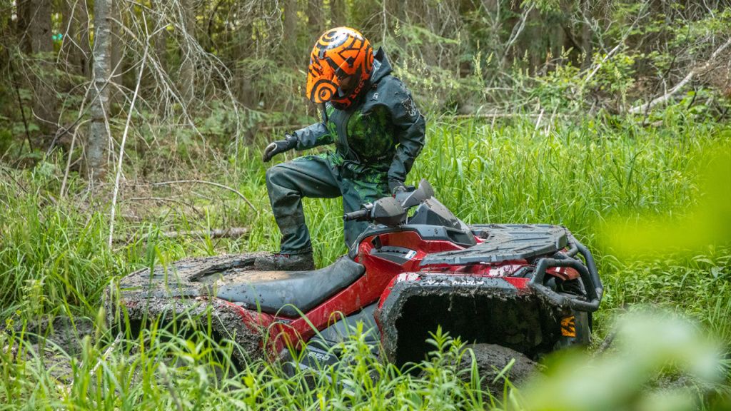 man atv in woods