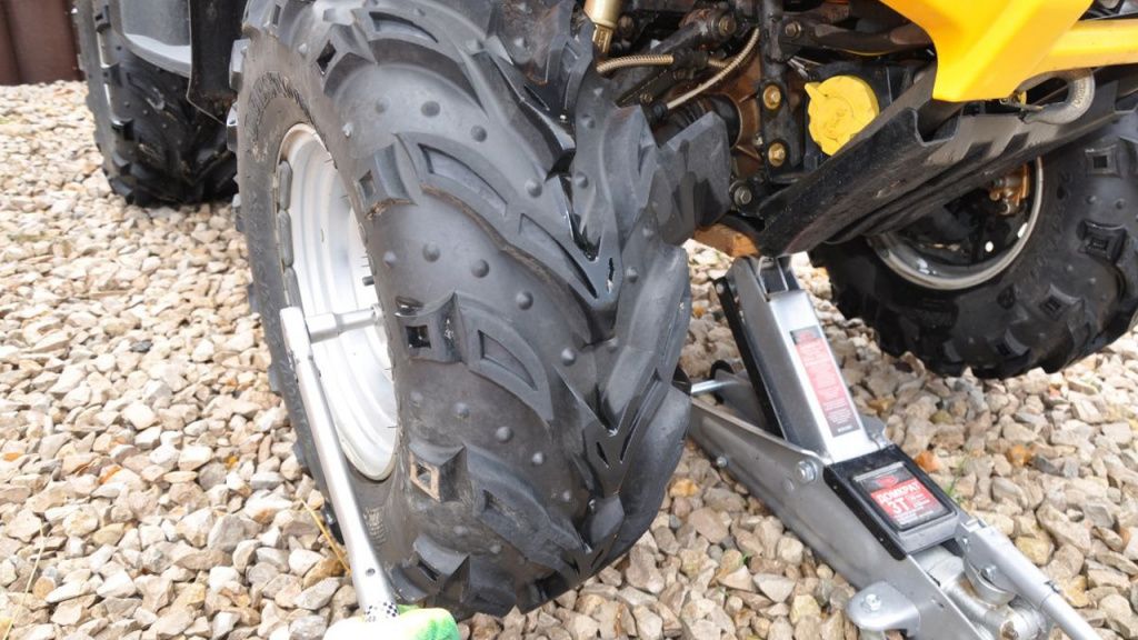 loosening the wheel lug nuts