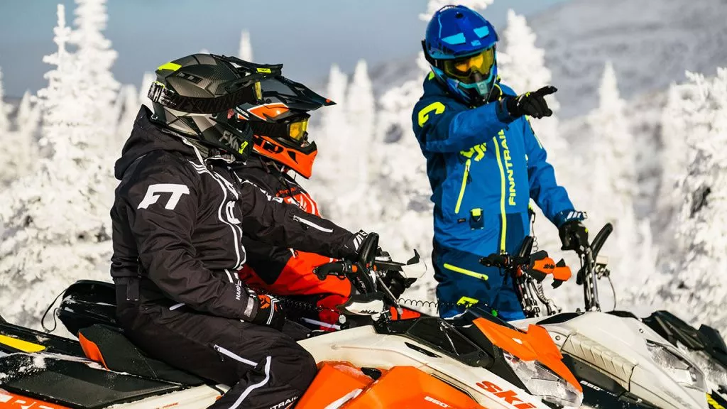 ride snowmobile in a group