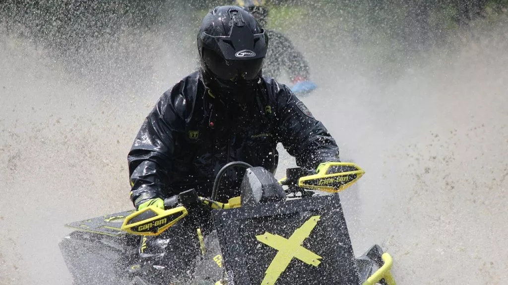 atv riding in water in helmet