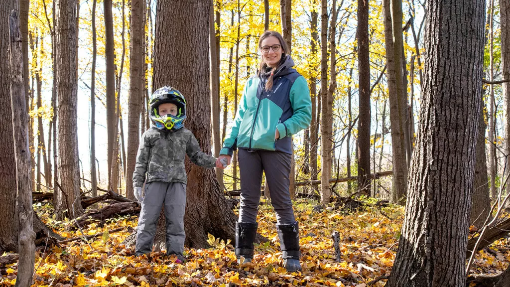 familiy walk in autumn forest
