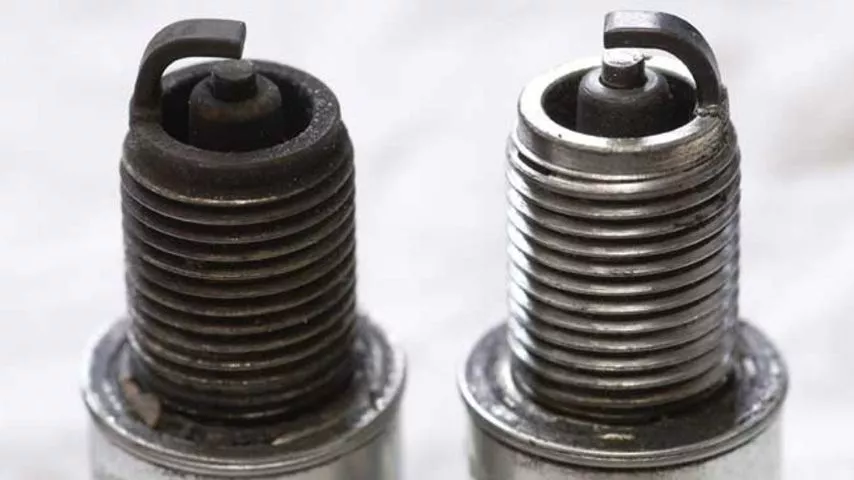 atv spark plug new and old
