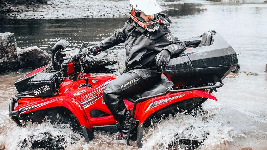 atv rider in waterproof gear