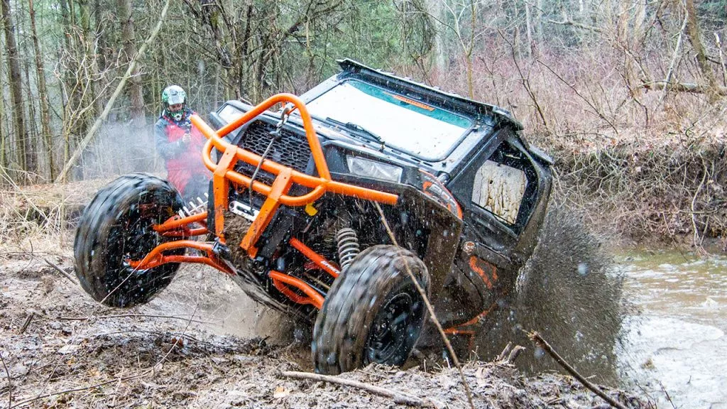 utv mud riding with windshield