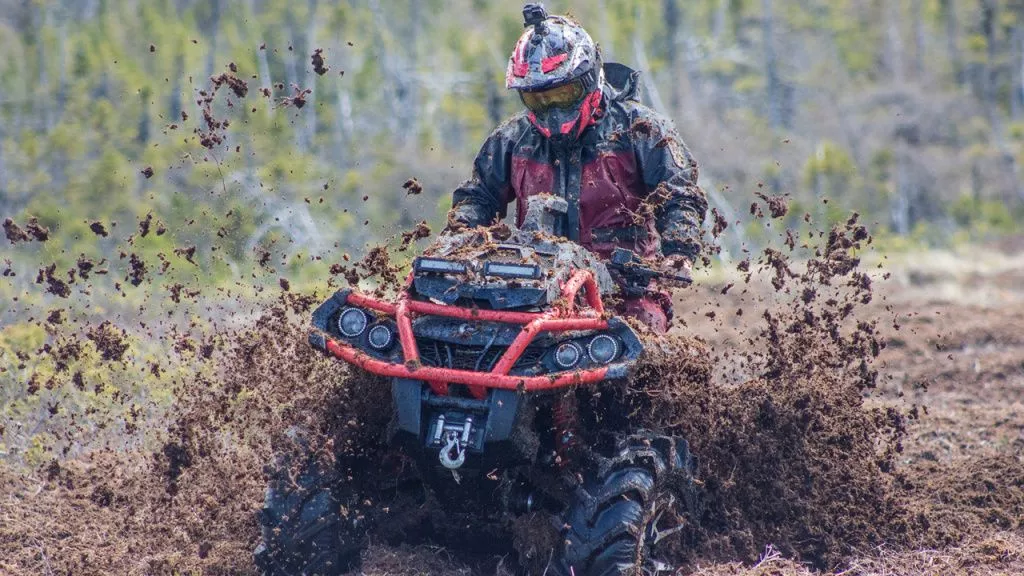 atv mud riding in goggles with helmet