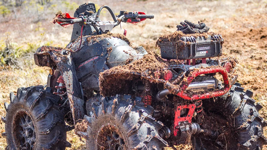 atv and exhaust in mud