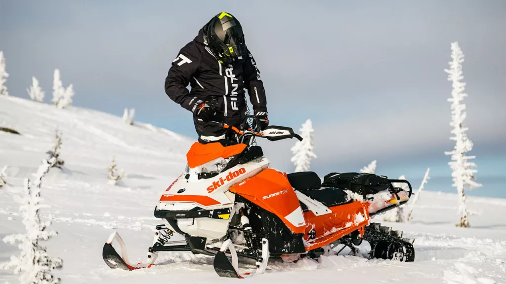 man on snowmobile man on snowmobile
