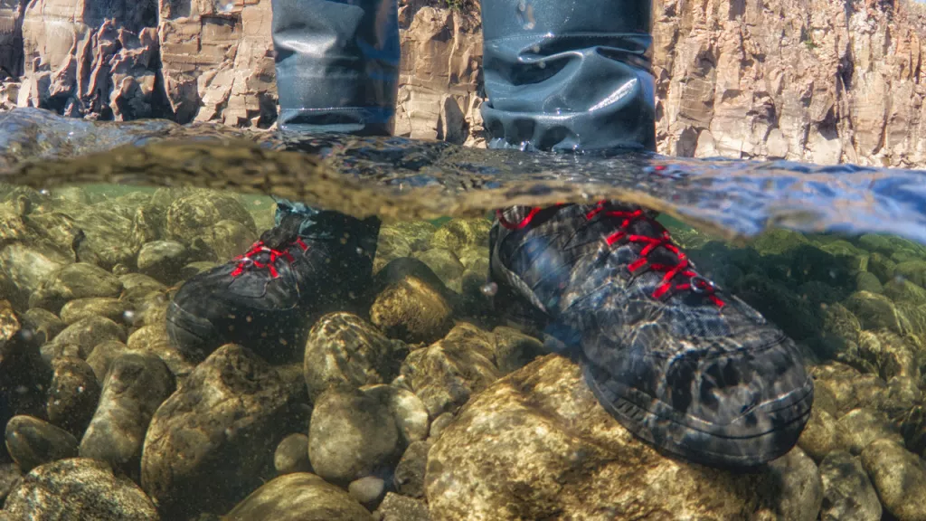 feet in wading boots under water.jpg