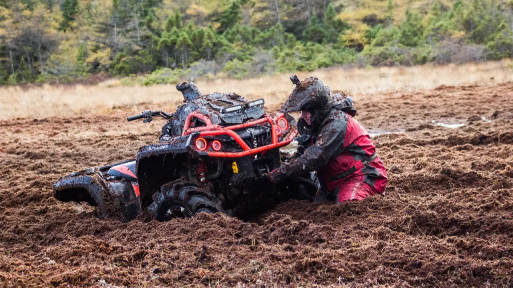 atv and winch in mud